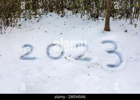 Written as 2023 on the snow covered ground Stock Photo