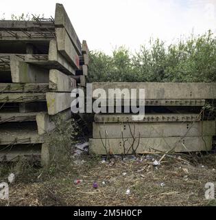 Abandoned concrete construction sections on site of former oil refinery Stock Photo