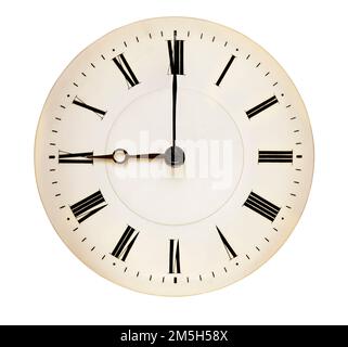 Antique clock face pointing at nine o'clock isolated against white background Stock Photo