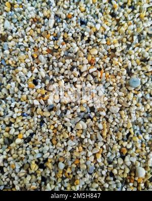 close-up macro sand background. extreme macro sand of a coastline. Stock Photo