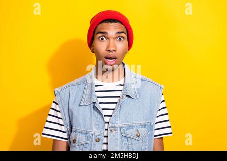 Portrait of impressed speechless person open mouth cant believe isolated on yellow color background Stock Photo