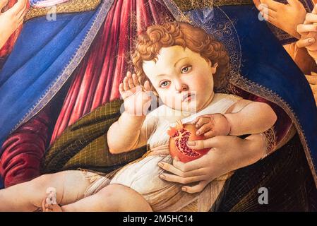 Close-up on handsome baby Jesus painted as holding a heart and giving a bless Stock Photo