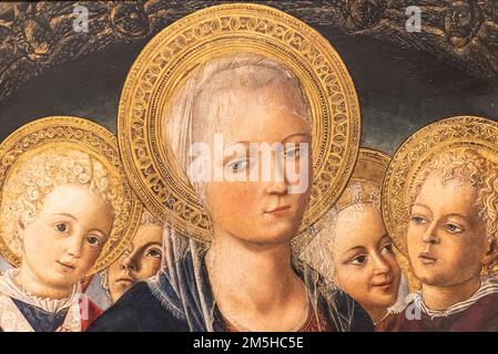 Close-up on medieval religious painting showing a group of young catholic saints Stock Photo