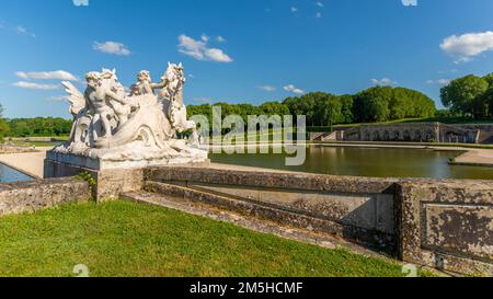 Maincy, France - May 21, 2022: A sculpture representing horses and cherubim in a french classical garden (Vaux-le-Vicomte). Photo taken in an early su Stock Photo