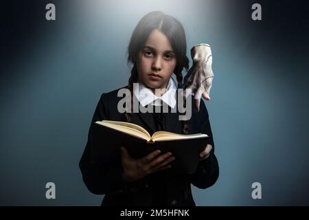 a girl Wednesday Addams. Halloween party Stock Photo