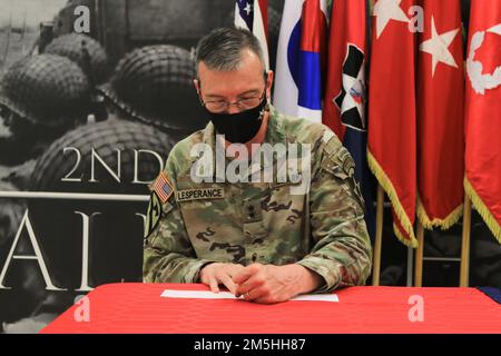 Maj. Gen. David Lesperance, commanding general of the 2nd Infantry Division/ROK-U.S. Combined Division, donates to the Army Emergency Relief March 18, 2022, on Camp Humphreys, Republic of Korea. The AER is a nonprofit organization charged with relieving undue financial stress to the forces of the U.S. Army. Stock Photo