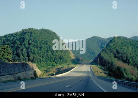 Country Music Highway - Highway 23 near Pikeville Looking South. Highway 23 cuts through tree-covered hills. Location: Near Pikeville, Kentucky Stock Photo