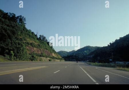 Country Music Highway - Highway 23 near Pikeville Looking South. Highway 23 cuts through a formed hillside. Location: Near Pikeville, Kentucky Stock Photo