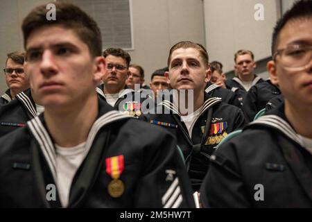 SILVERDALE, Wash. (March 18, 2022) – U.S. Sailors attend a change of command ceremony for the Ohio-class ballistic-missile submarine USS Nevada (SSBN 733), March 18, 2022. Nevada, homeported at Naval Base Kitsap, Wash., is the eighth Ohio-class submarine and the fourth U.S. Navy ship to bear the name Nevada. The submarine was commissioned in Groton, Conn., Aug. 16, 1986. Stock Photo