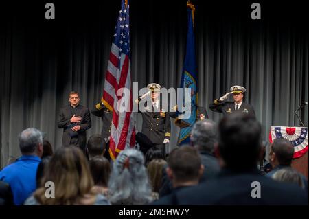 SILVERDALE, Wash. (March 18, 2022) – The official party of a change of command ceremony for the Ohio-class ballistic-missile submarine USS Nevada (SSBN 733) salutes during the national anthem, March 18, 2022. Nevada, homeported at Naval Base Kitsap, Wash., is the eighth Ohio-class submarine and the fourth U.S. Navy ship to bear the name Nevada. The submarine was commissioned in Groton, Conn., Aug. 16, 1986. Stock Photo