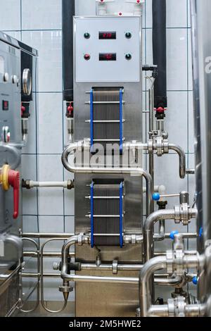Stainless steel tank with control panel for brewing in plant for the production of alcohol drinks Stock Photo