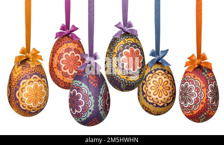 Set of colorful pattern Easter decoration eggs hanging in silk ribbon bow, isolated Stock Photo