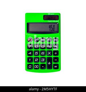 Green pocket calculator with solar and battery powering, close-up on white background Stock Photo
