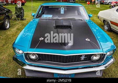 Iola, WI - July 07, 2022: High perspective front view of a 1969 Ford Mustang Mach 1 Fastback at a local car show. Stock Photo