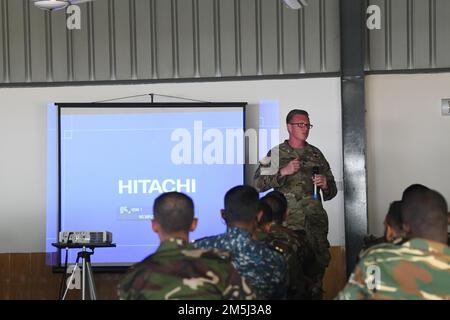 U.S. Army Sgt. 1st Class, William Rohler, an Explosive Ordnance Disposal (EOD) technician from the 303rd EOD Battalion out of Schofield Barracks, Hawaii, talks to Bangladeshi Army members during the Exercise Tiger Lightning 2022 lecture on convoy improvised explosive devices, March 19, 2022 at the Bangladesh Institute of Peace Support Operation Training center in Dhaka, Bangladesh. TL22 is a bilateral exercise sponsored by the U.S. Indo-Pacific Command and hosted by the Bangladesh Armed Forces, strengthening Bangladesh defense readiness, building operational interoperability, and reinforcing p Stock Photo