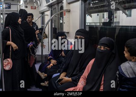 Passengers travel inside a Dhaka Metro train from Uttara North to Agargaon. Prime Minister Sheikh Hasina formally inaugurated the country's first metro rail. Stock Photo