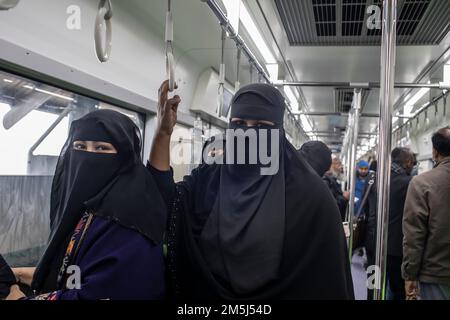 Passengers travel inside a Dhaka Metro train from Uttara North to Agargaon. Prime Minister Sheikh Hasina formally inaugurated the country's first metro rail. Stock Photo