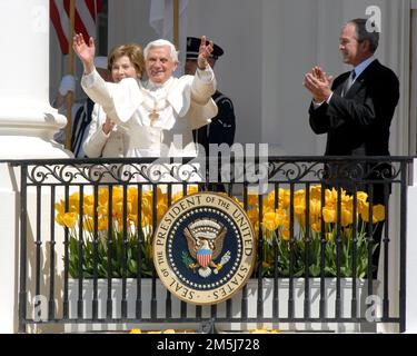 Pope Benedict XVI, raises his hands from the balcony of the White House in Washington, D.C. on Wednesday, April 16, 2008.  First lady Laura Bush, far left, and United States President George W. Bush, far right, applaud..Credit: Ron Sachs / CNP.(RESTRICTION: NO New York or New Jersey Newspapers or newspapers within a 75 mile radius of New York City) / MediaPunch Stock Photo