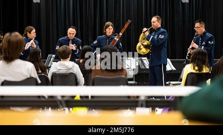 The Winds Aloft U.S. Air Forces in Europe Woodwind Quintet performs for international students at Ankara Elementary/High School in Ankara, Turkey, March 18, 2022. Winds Aloft members conducted musical master classes and performances for over 100 Ankara Elementary/High School students, representing more than 30 countries. As a tenant of the 717th Air Base Squadron and Department of Defense Education Activity school, Ankara Elementary/High School supports DOD, U.S. Department of State and international diplomatic corps families. Winds Aloft traveled to several cities and military installations i Stock Photo