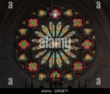 Montpellier, France - 12 29 2022 : View of colorful stained glass rosette above main entrance of ancient St Roch or Saint Roch church Stock Photo