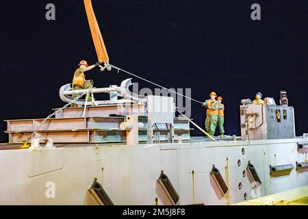 Sailors use an Improved Navy Lighterage System (INLS) power module ...