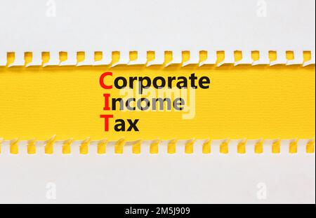 CIT corporate income tax symbol. Concept words CIT corporate income tax on white paper on a beautiful yellow background. Business and CIT corporate in Stock Photo