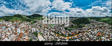 Panoramic aerial drone view of Manhuacu in Minas Gerais, Brazil, famous for coffee plantations Stock Photo