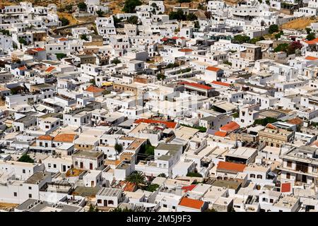 Lindos, Rhodes, Greece - May 2022: Aerial view of whitewashed buildings in the town Stock Photo