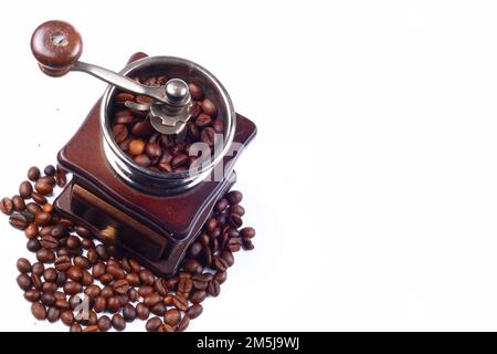 Old Vintage Coffee Grinder And Roasted Coffee Beans On White Background With Copy Space Stock Photo