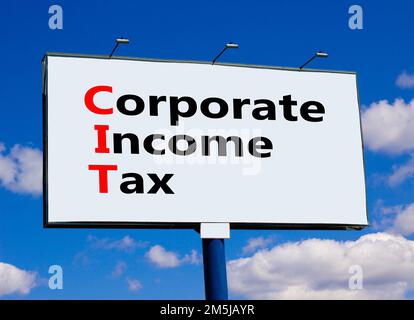 CIT corporate income tax symbol. Concept words CIT corporate income tax on big billboard on a beautiful blue sky and clouds background. Business and C Stock Photo