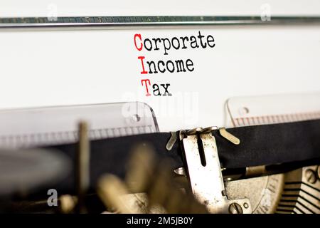 CIT corporate income tax symbol. Concept words CIT corporate income tax typed on old retro typewriter. Beautiful white background. Business and CIT co Stock Photo