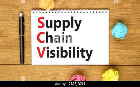 SCV supply chain visibility symbol. Concept words SCV supply chain visibility on white note on a beautiful wooden background. Business SCV supply chai Stock Photo