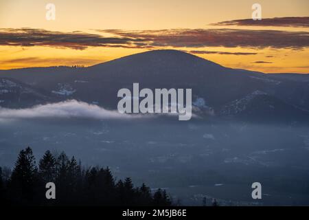 Winter sunset in Moravian-Silesian Beskids in Czech Republic, view of the Ostry peak with elevation of 1045 meters Stock Photo