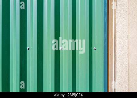 Detail of corrugated metal siding on modern building exterior wall Stock Photo