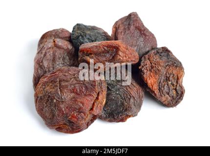 Whole Sun-dried apricots with stones. Isolated on white background. Stock Photo
