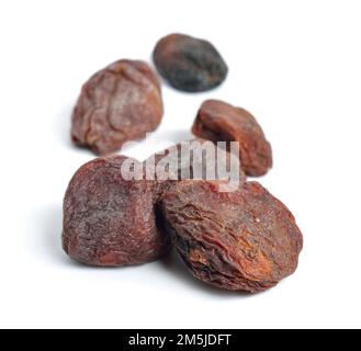 Whole Sun-dried apricots with stones. Isolated on white background. Stock Photo