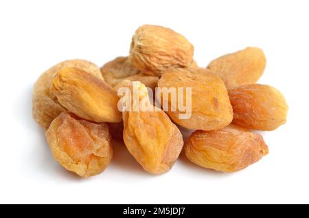 Whole Sun-dried apricots with stones. Isolated on white background. Stock Photo