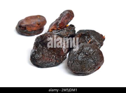Whole Sun-dried apricots without stones. Isolated on white background. Stock Photo
