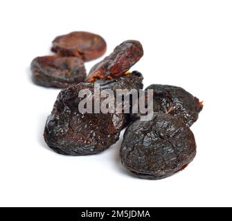 Whole Sun-dried apricots without stones. Isolated on white background. Stock Photo