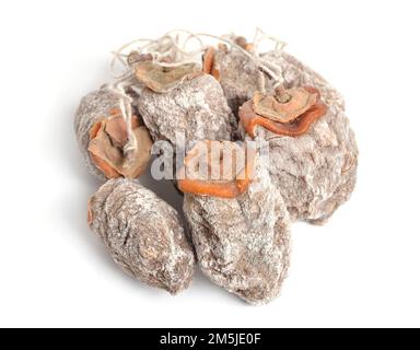 Whole dried oriental persimmons isolated on white background. Stock Photo