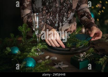 Woman preparing festive place setting Stock Photo