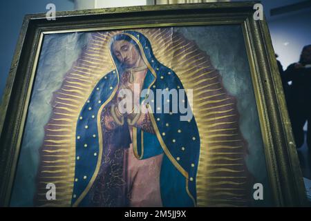 A priest named Claudio officiates a mass during the celebration of the day of the Virgin of Guadalupe in the parish of Our Lady of Guadalupe on December 12 in Canea Sonora (photo by Luis Gutiérrez) Un sacerdote de nombre Claudio oficia una misa durante la celebración del día de la virgen de Guadalupe en la parroquia de Nuestra Señora de Guadalupe el 12 de diciembre en Canea Sonora (foto por Luis Gutiérrez ) Stock Photo