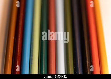 This is a photo of 12 Prismacolor pencils arranged in a vertical rainbow. Stock Photo