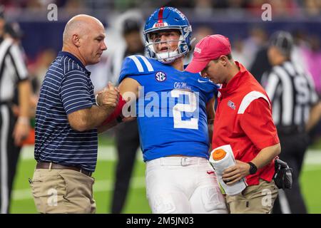 Ole Miss Rebels quarterback Jaxson Dart (2) is helped up by the sports medicine staff after landing awkwardly on hit head after diving into the endzon Stock Photo