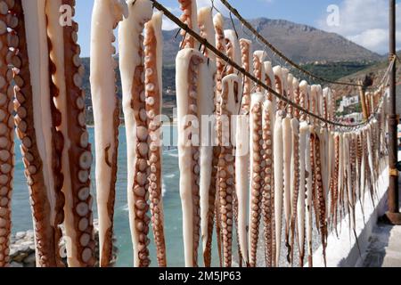 Octopus hanging to dry out in the sun, sea food, greece Stock Photo