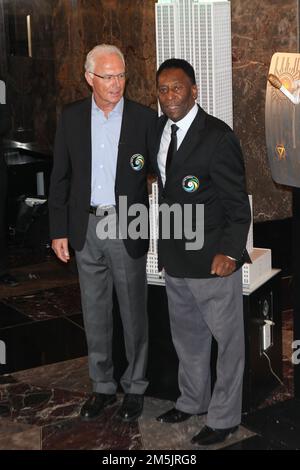 New York, NY, USA. 17th Apr, 2022. The New York Cosmos legends, Pele and Franz Beckenbauer light the Empire State Building 'Cosmos Green' to launch and celebrate the start of the team's 2015 Spring season at The Empire State Building on April 17, 2015 in New York City. Credit: Diego Corredor/Media Punch/Alamy Live News Stock Photo