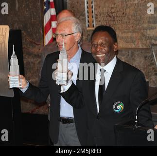 New York, NY, USA. 17th Apr, 2022. The New York Cosmos legends, Pele and Franz Beckenbauer light the Empire State Building 'Cosmos Green' to launch and celebrate the start of the team's 2015 Spring season at The Empire State Building on April 17, 2015 in New York City. Credit: Diego Corredor/Media Punch/Alamy Live News Stock Photo