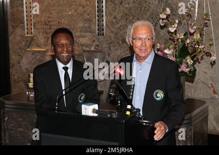 New York, NY, USA. 17th Apr, 2022. The New York Cosmos legends, Pele and Franz Beckenbauer light the Empire State Building 'Cosmos Green' to launch and celebrate the start of the team's 2015 Spring season at The Empire State Building on April 17, 2015 in New York City. Credit: Diego Corredor/Media Punch/Alamy Live News Stock Photo