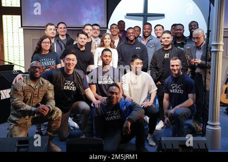 Soldiers assigned to 2nd Battalion, 34th Armored Regiment, 1st Armored Brigade Combat Team, 1st Infantry Division pose for a photo after a church service at Szczecin, Poland, March 20, 2022. Stock Photo