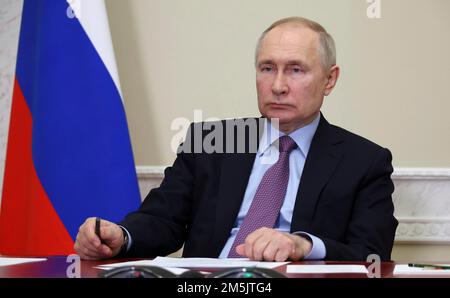St Petersburg, Russia. 28th Dec, 2022. Russian President Vladimir Putin takes part in a ceremonial launch for production at the Titan-Polymer plant, December 28, 2022 in St Petersburg, Russia. The new manufacturing facility replaces imported product stopped by economic sanctions. Credit: Mikhail Klimentyev/Kremlin Pool/Alamy Live News Stock Photo